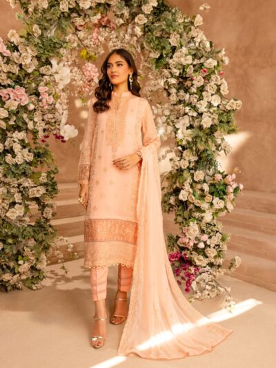 A woman standing in front of a floral arch