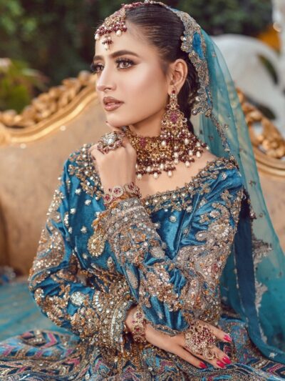 A bride in a beautiful, elaborate, and expensive outfit.